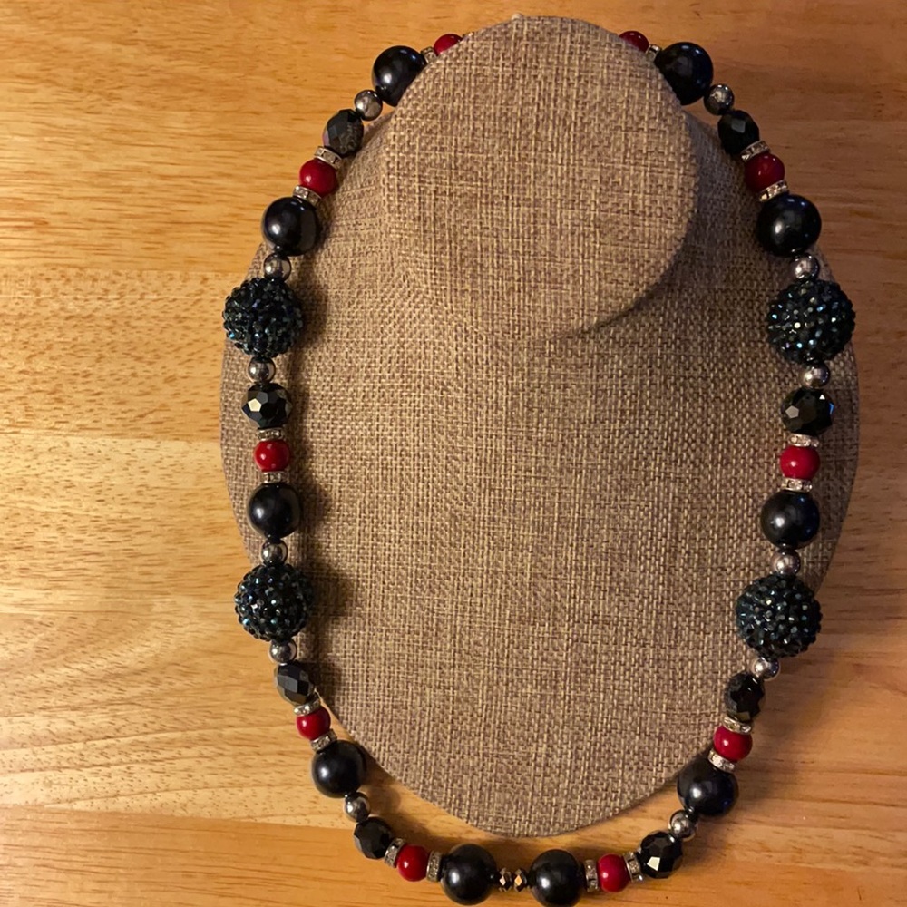 Necklace with beads and crystals. 24” long. Blue, black and red.